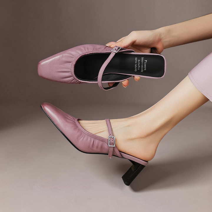 Vivian &amp; Cole Vanya lilac leather ruched Mary Jane mule with a square toe and sculpted block heel on a model