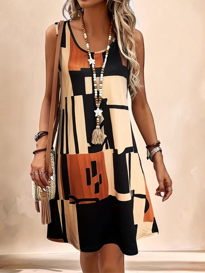 Vivian &amp; Cole Marguerite sleeveless A-line dress featuring a geometric abstract print in tan, black, and burnt orange.