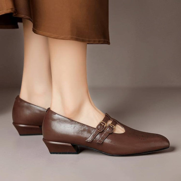 Vivian &amp; Cole Marisol brown leather Mary Jane pumps with brogue detailing, dual buckled straps, and a low block heel.