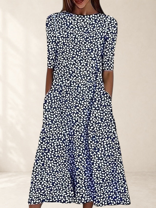 Vivian & Cole navy blue midi dress with white floral print, boat neck, short sleeves, and pockets.