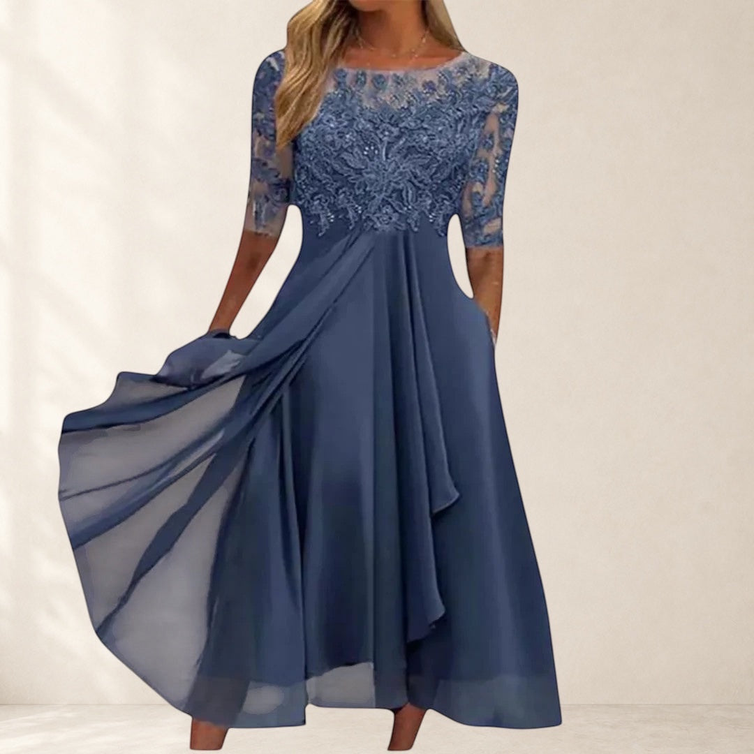 Vivian & Cole navy blue lace dress with flowing chiffon skirt and 3/4 sleeves, perfect for special occasions.