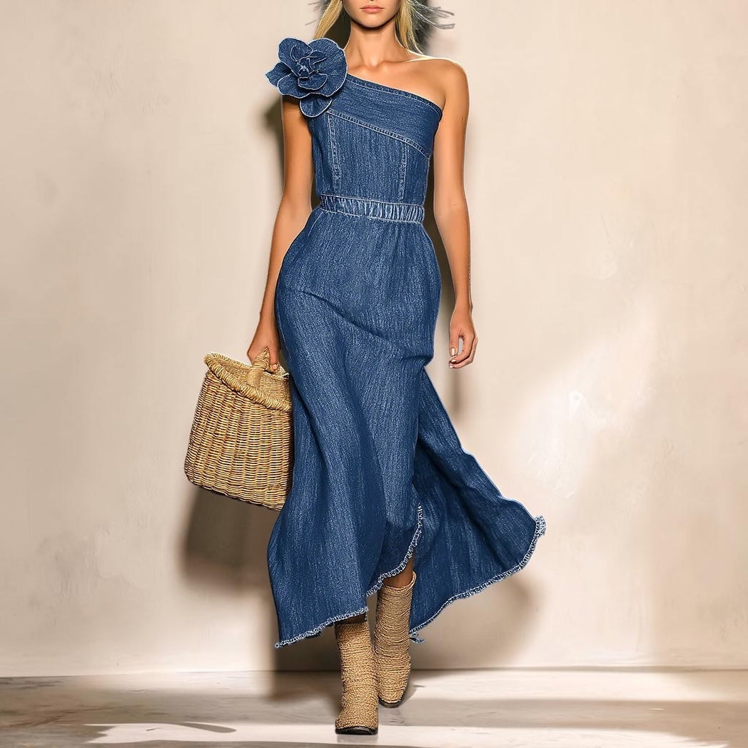 Vivian &amp; Cole off-shoulder blue denim maxi dress featuring a 3D floral accent on the bodice and a raw hemline