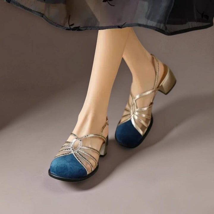Vivian &amp; Cole Pearl blue and gold strappy buckle sandals with a low block heel worn on a model