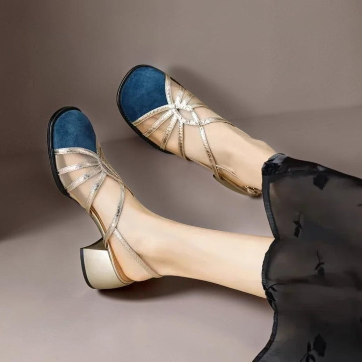 Vivian &amp; Cole Pearl breathable sandals featuring a blue suede toe, gold metallic straps, and a comfortable block heel.