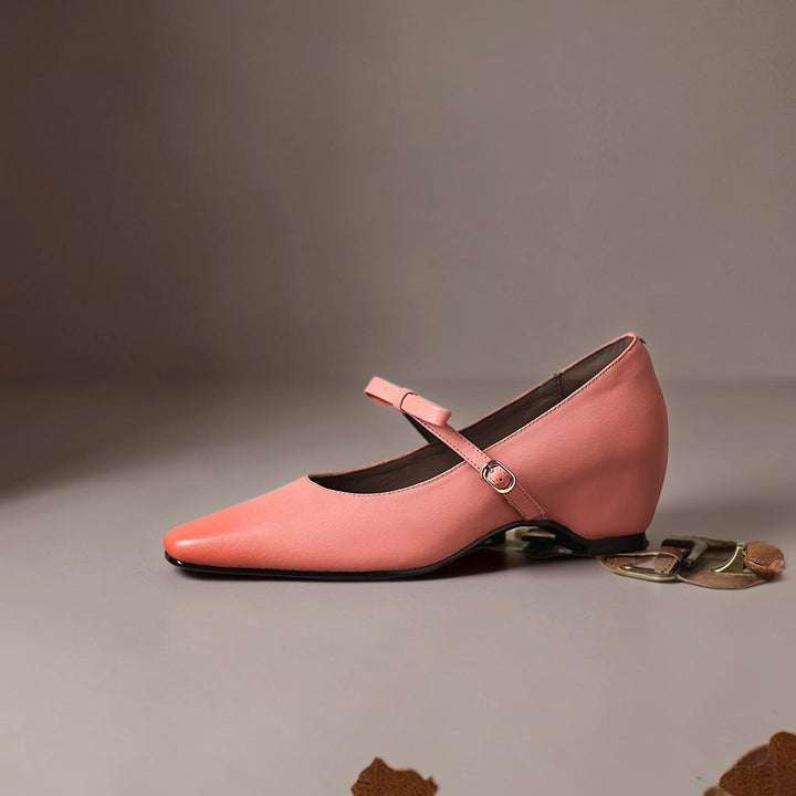 Vivian &amp; Cole pink leather Mary Jane pump with a bow-tie strap and a concealed block heel on a neutral background.