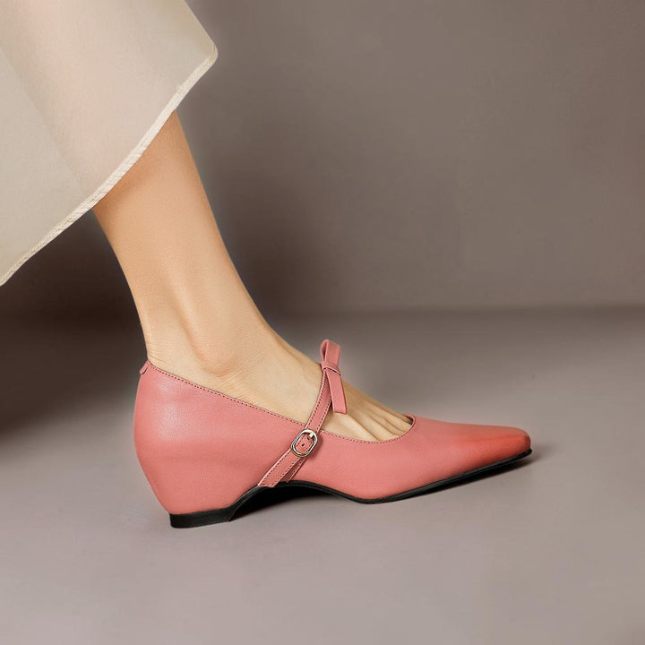 Vivian &amp; Cole pink leather Mary Jane pump with a bow-tie strap and concealed block heel on a model&