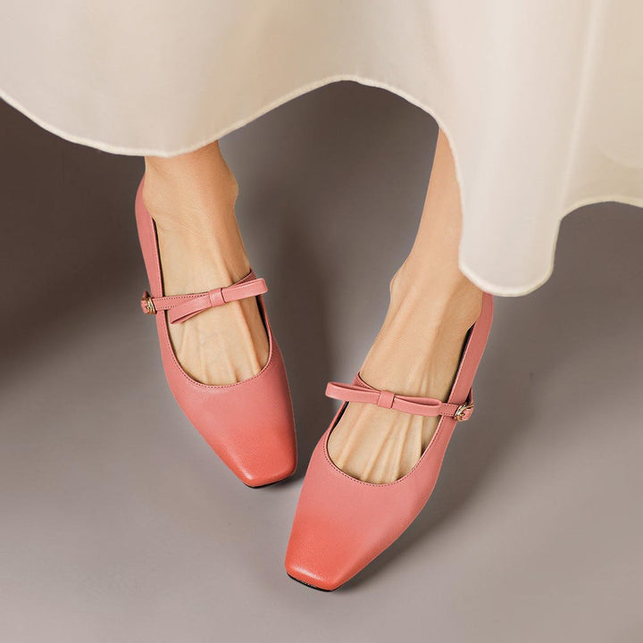Vivian &amp; Cole Bryony pink leather Mary Jane pumps featuring a bow-tie strap and burnished edges on a block heel.
