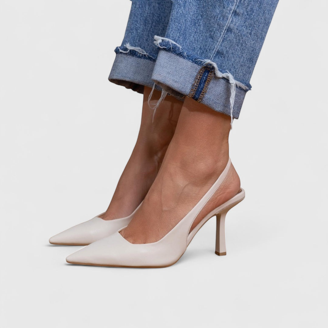 Vivian &amp; Cole Bella light pink pointed toe slingback heels with a sculpted heel.