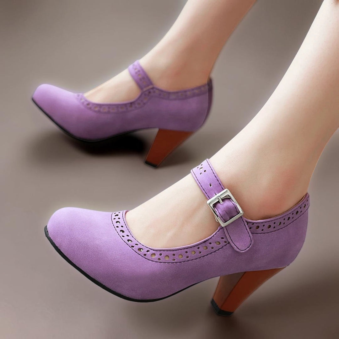Vivian &amp; Cole purple suede Mary Jane heels with an adjustable strap, rounded toe, and a sturdy wooden-look block heel.