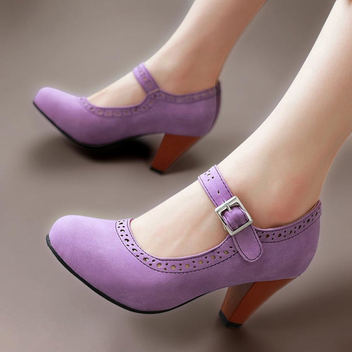 Vivian &amp; Cole purple suede Mary Jane heels with an adjustable strap, rounded toe, and a sturdy wooden-look block heel.