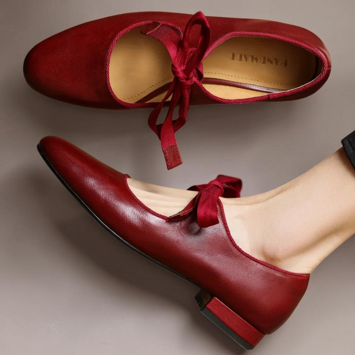 Vivian &amp; Cole red leather Mary Jane flats featuring a delicate bow detail and a comfortable low heel