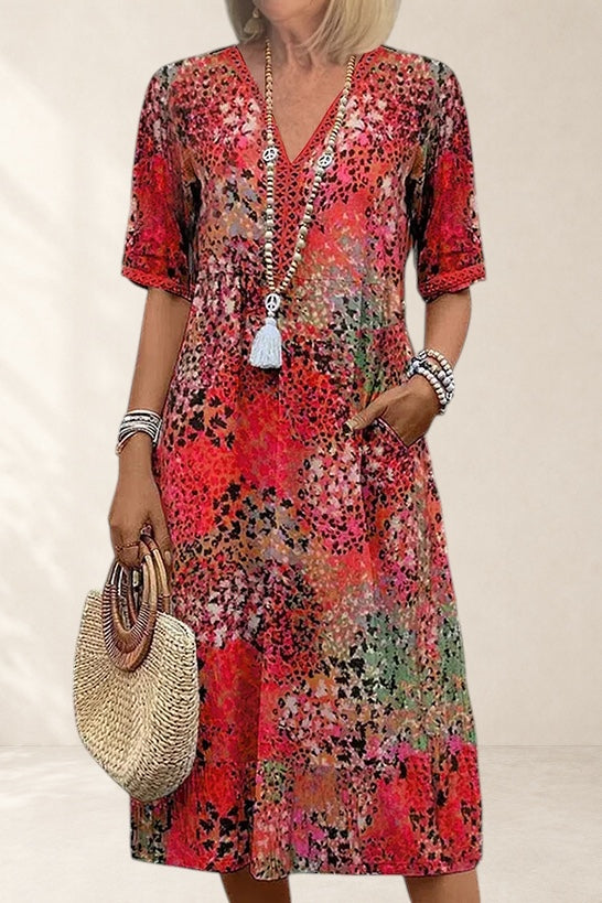 Vivian & Cole Veronica Vibrant Midi Dress, a red floral print midi dress with short sleeves and pockets.