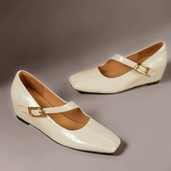 Vivian &amp; Cole Viora glossy cream genuine leather Mary Jane heels with a square toe and gold-tone buckle strap.