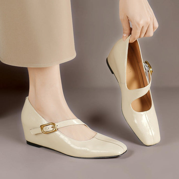 Vivian &amp; Cole Viora cream glossy genuine leather Mary Jane heels with a square toe, tilted buckle strap, and wedge sole