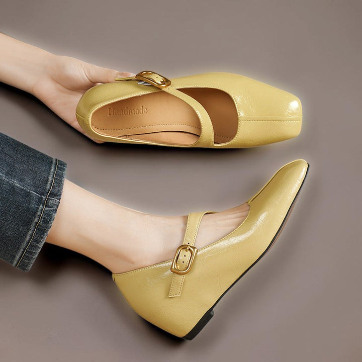 Vivian &amp; Cole Viora glossy yellow genuine leather Mary Jane heels with a square toe and tilted buckle strap.