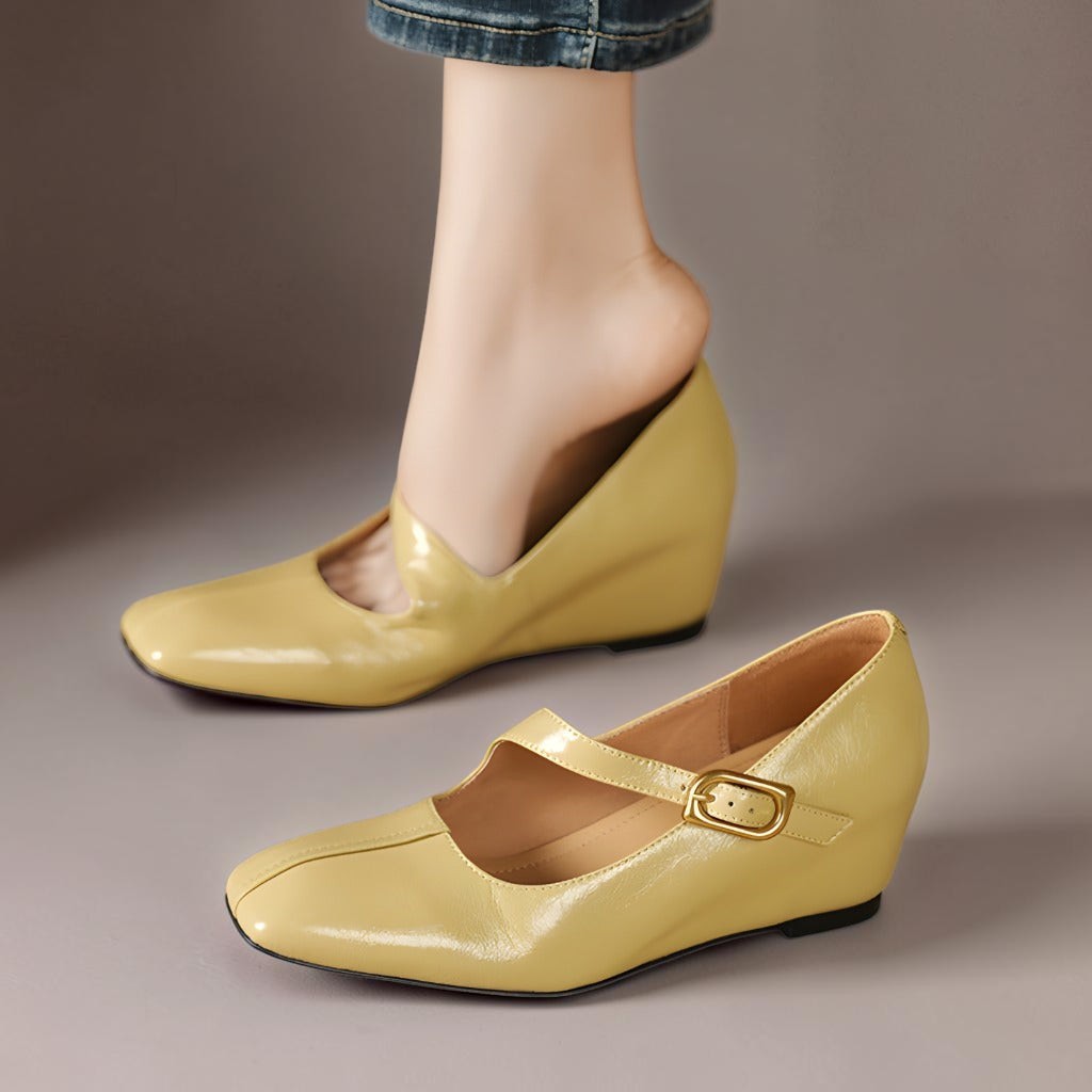 Vivian &amp; Cole Viora glossy yellow genuine leather Mary Jane heels with a square toe, buckle strap, and wedge sole.