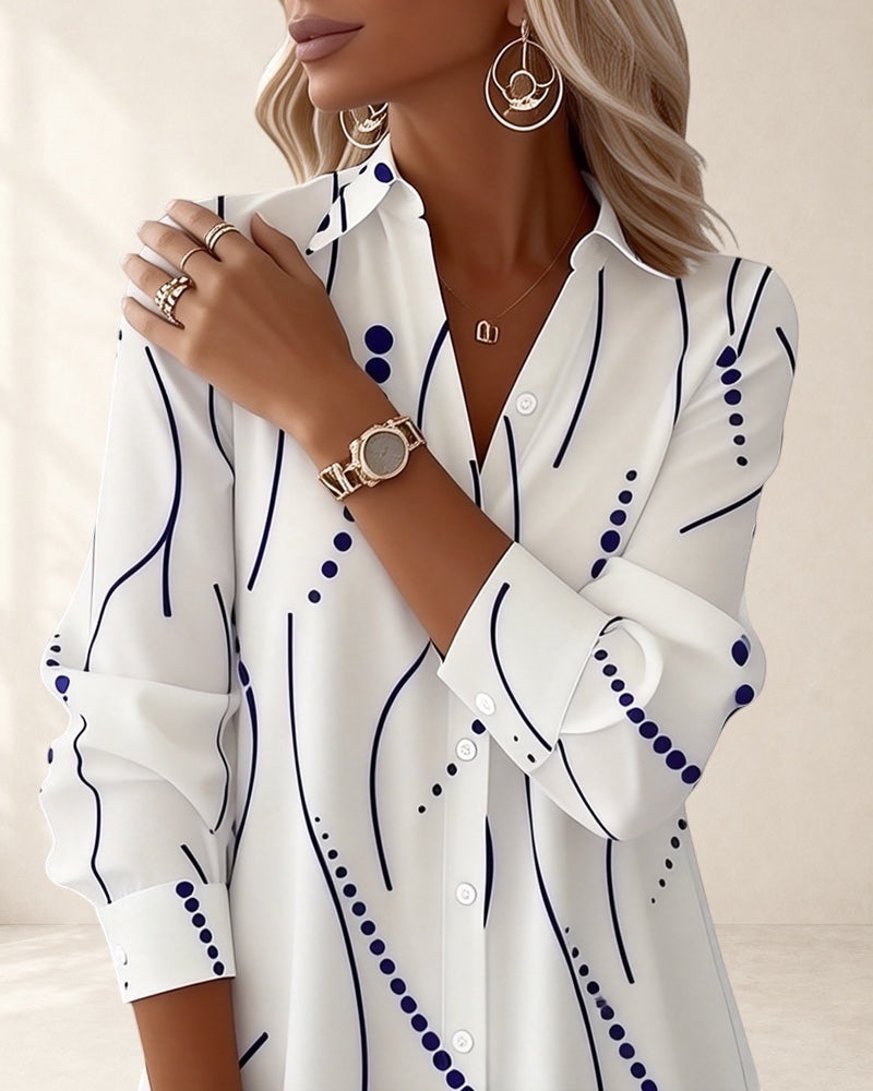 Vivian &amp; Cole white long sleeve A-line dress with wavy blue stripe pattern and lapel collar.