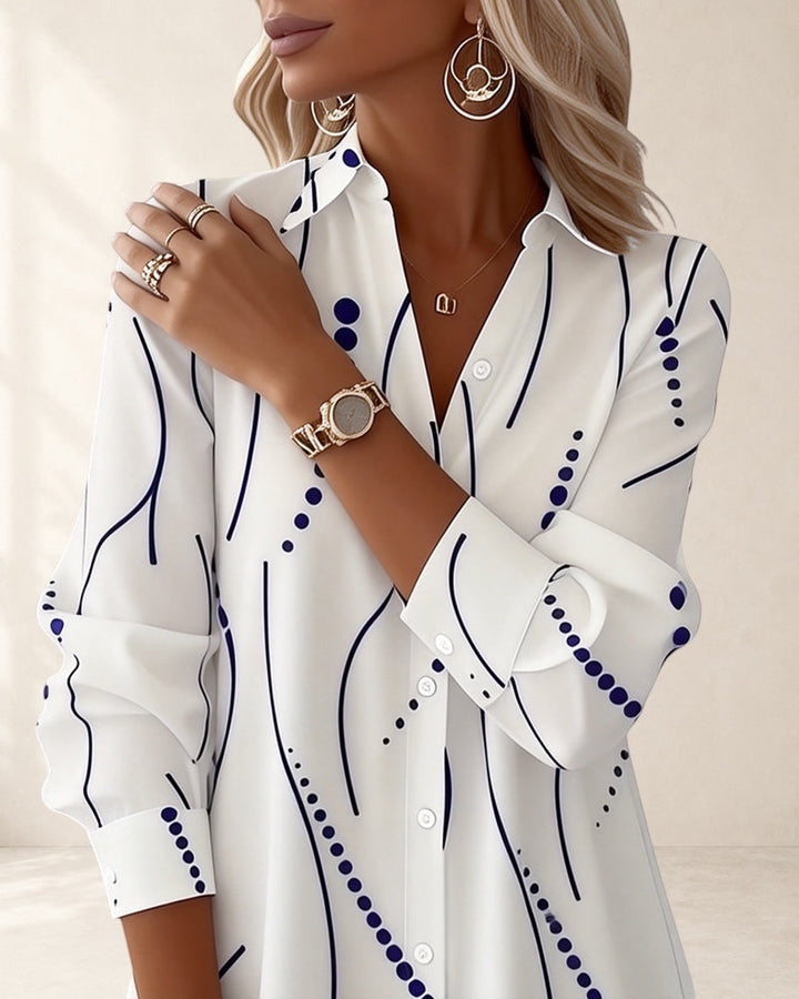 Vivian &amp; Cole white long sleeve A-line dress with wavy blue stripe pattern and lapel collar.