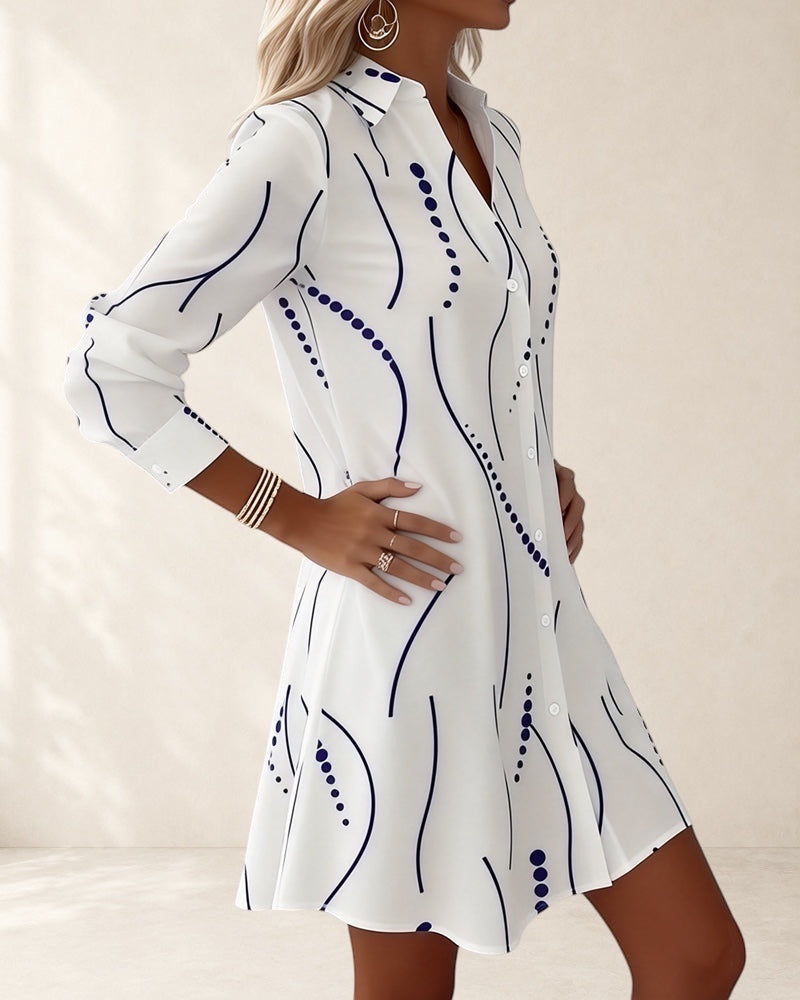 Vivian &amp; Cole white A-line dress with wavy blue stripes and dots pattern, lapel collar, long sleeves, above knee length.
