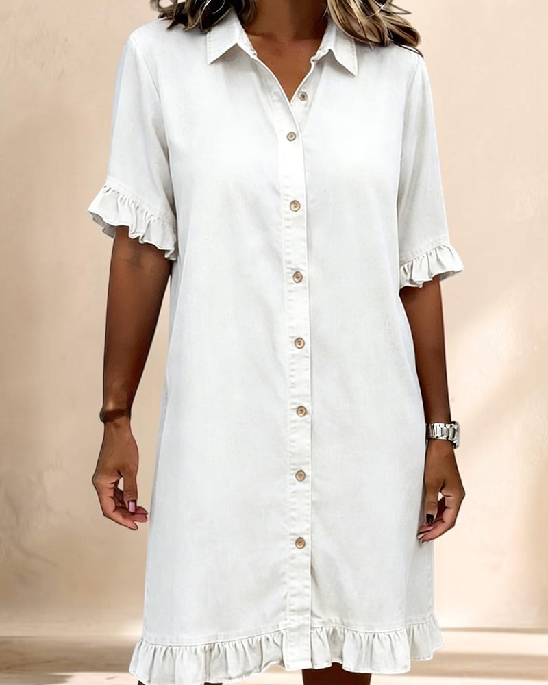 Vivian &amp; Cole white denim shirt dress with a button-down front, smocked waist, and ruffled short sleeves.