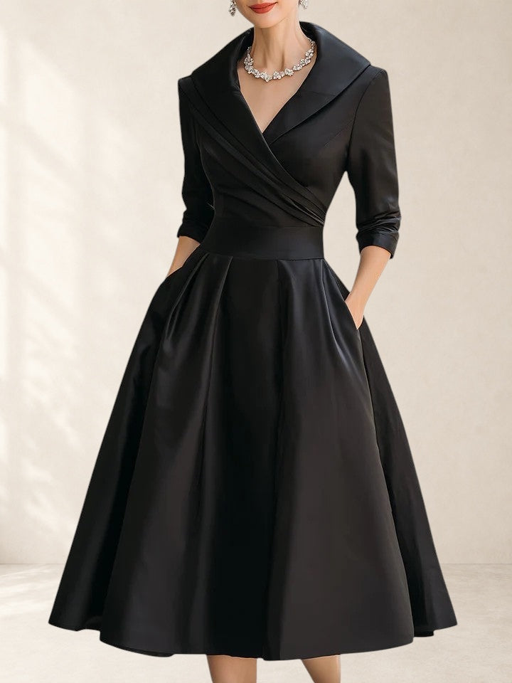 Vivian &amp; Cole Yan black satin midi dress with pockets, V-neck, and 3/4 sleeves.