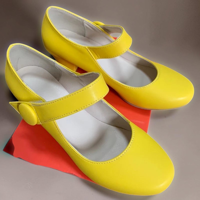 Vivian &amp; Cole Clementine bright yellow block heel Mary Jane shoes with an adjustable instep strap and rounded toe.
