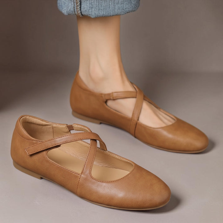 Vivian &amp; Cole Zeor tan genuine leather flats featuring crossover straps, round toe, and velcro closure.